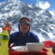 Enjoying a meal with snowy mountains in the background